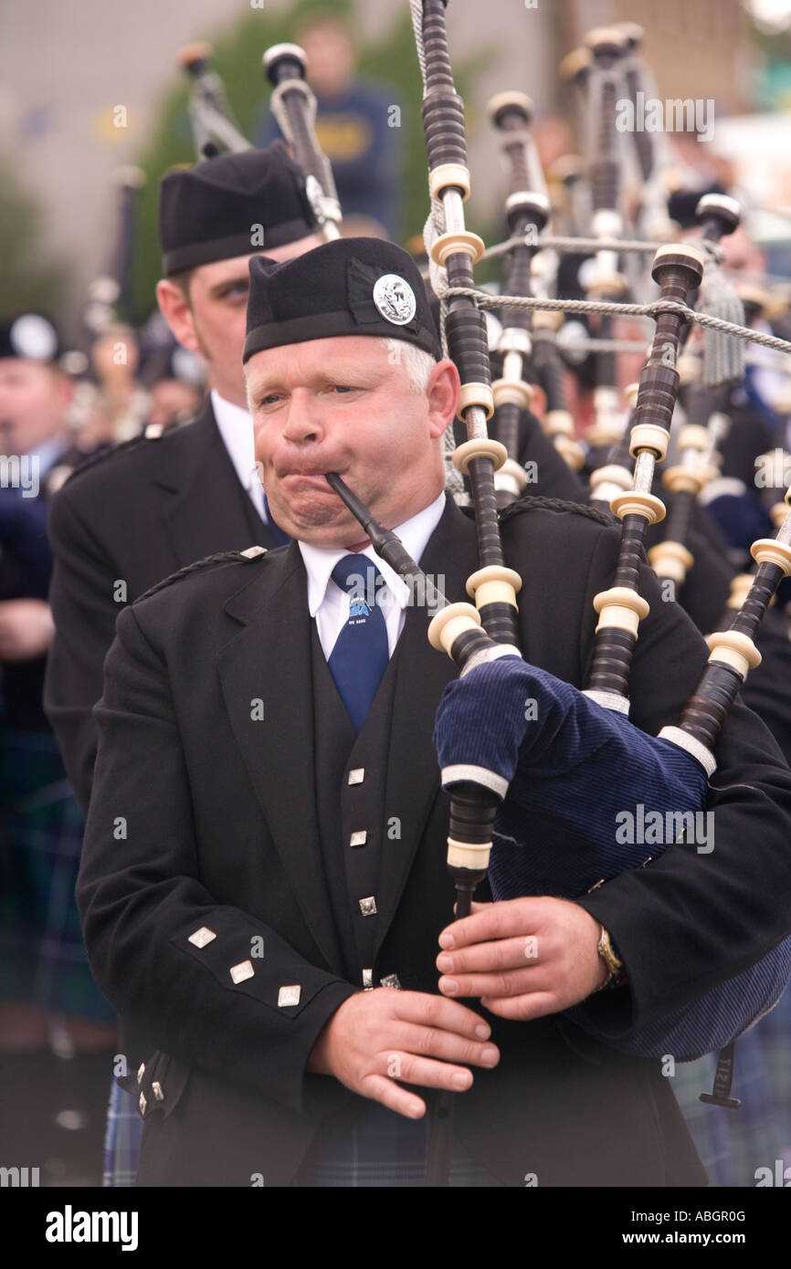 Scottish traditional music bag pipes piper marching in pipe band part