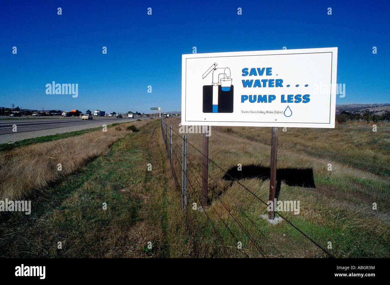 Water conservation sign by highway. Stock Photo