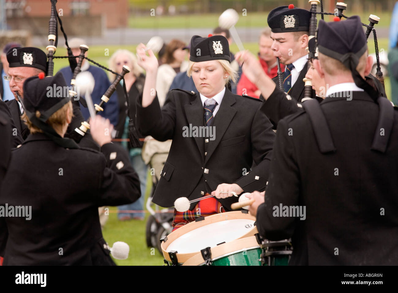 Scottish traditional music pipe band competition drummers drumming at
