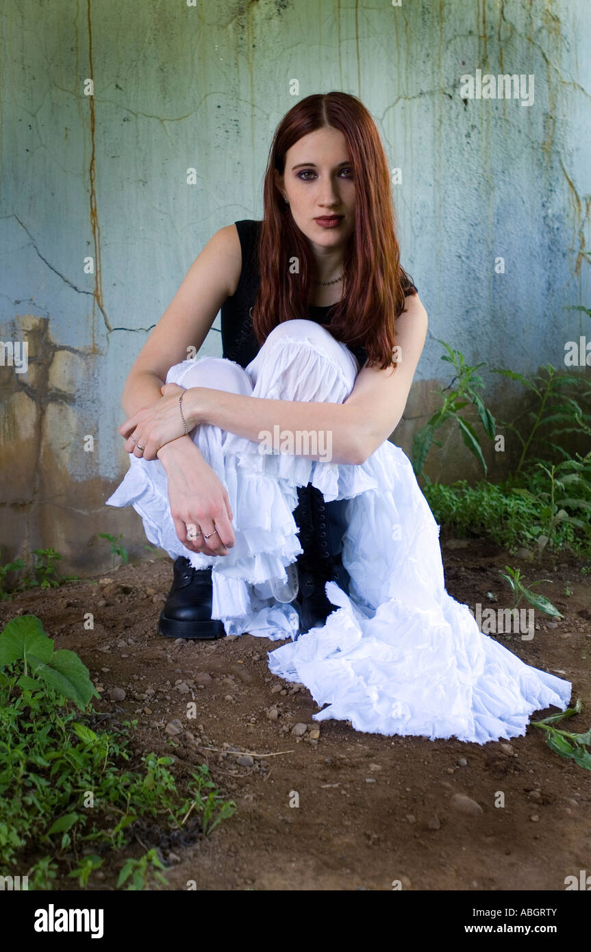 Outdoor portrait of a girl in a black top and a white skirt Stock Photo