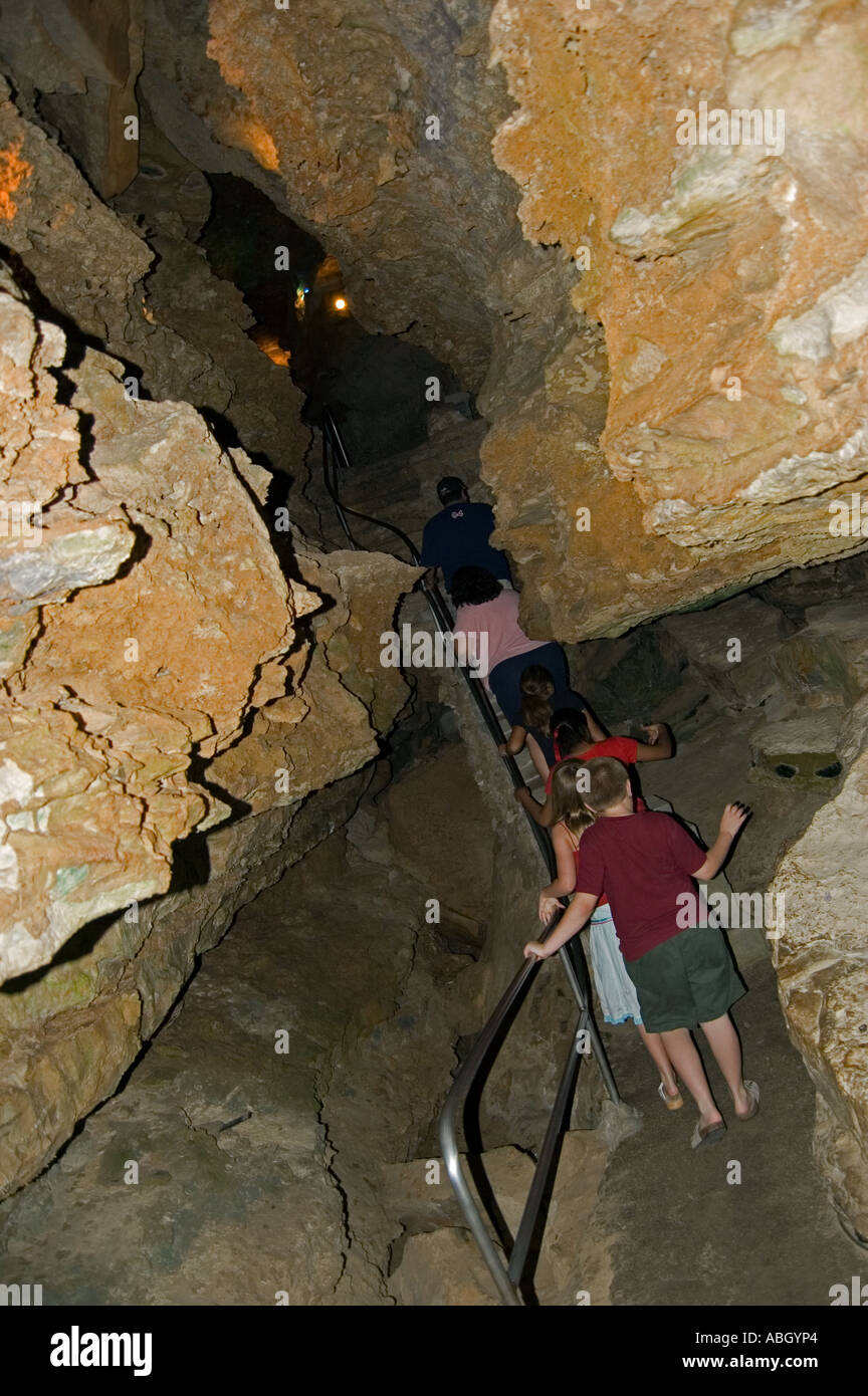 Tourists Going Through An Underground Cave Stock Photo Alamy