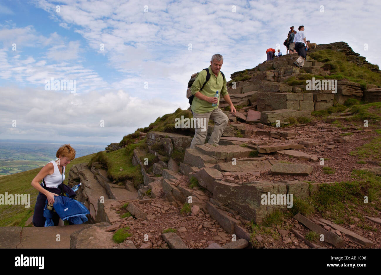 Groups of walkers ascend Corn Du in the Brecon Beacons Powys Wales UK Stock Photo