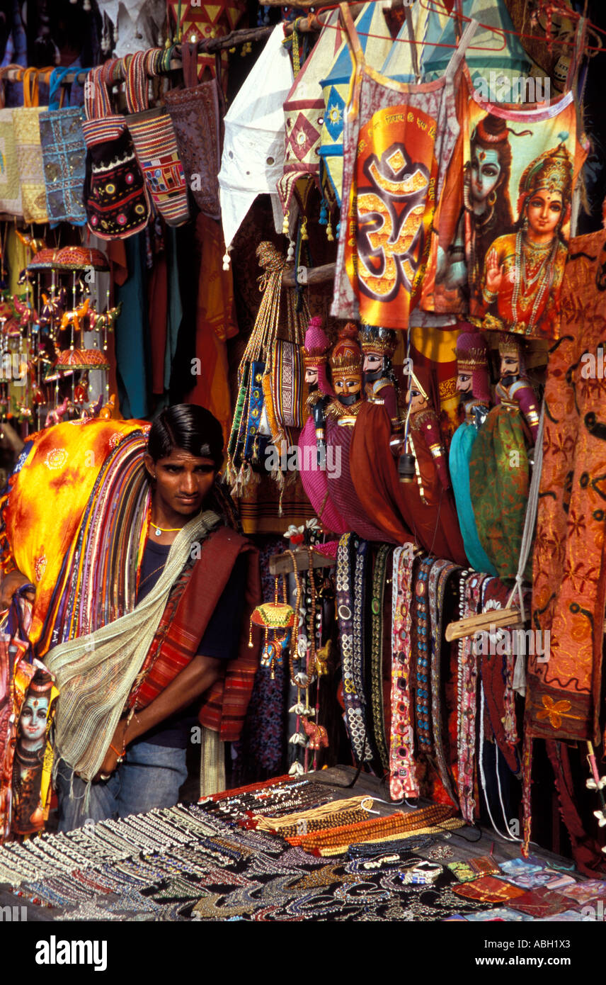 Male Indian hawker armed with fabrics at stall, Varkala Beach, Kerala, South India Stock Photo