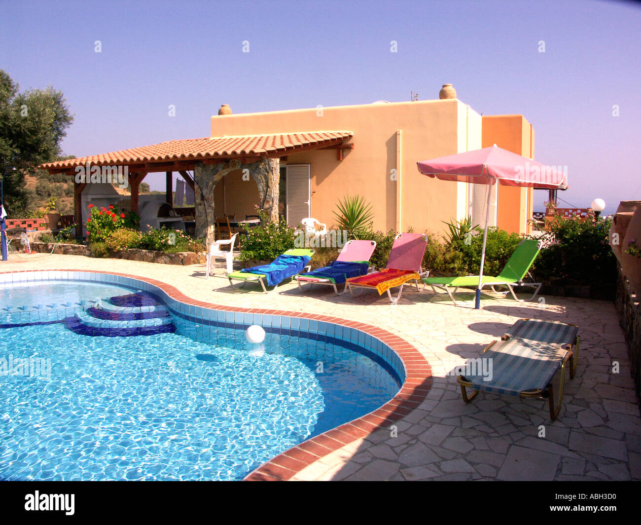 Typical Villa and Pool Stalos Crete Stock Photo