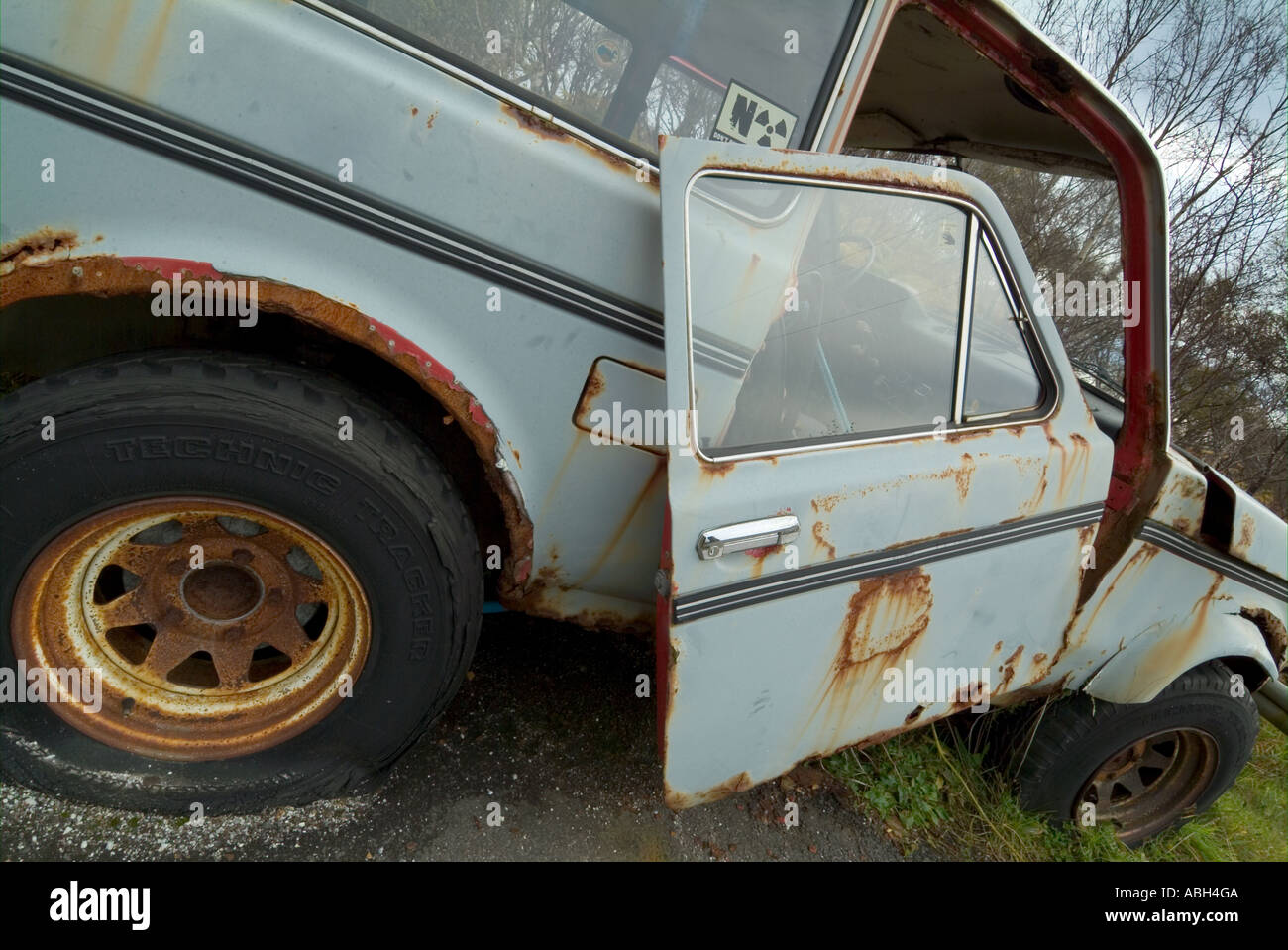 Lada car wreck with door falling off Scotland UK GB EU Europe Stock