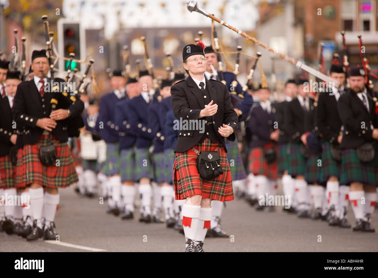 Scottish traditional music bag pipers pipe band marching down Annan