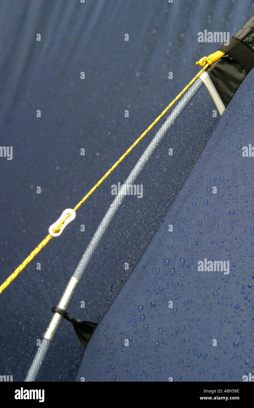 Tension concept of tent guy rope and water droplets formed from surface tension Stock Photo
