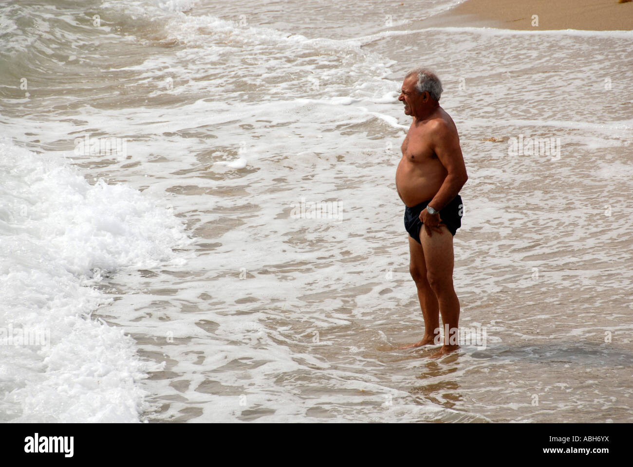 Senior male enjoying surf Stock Photo