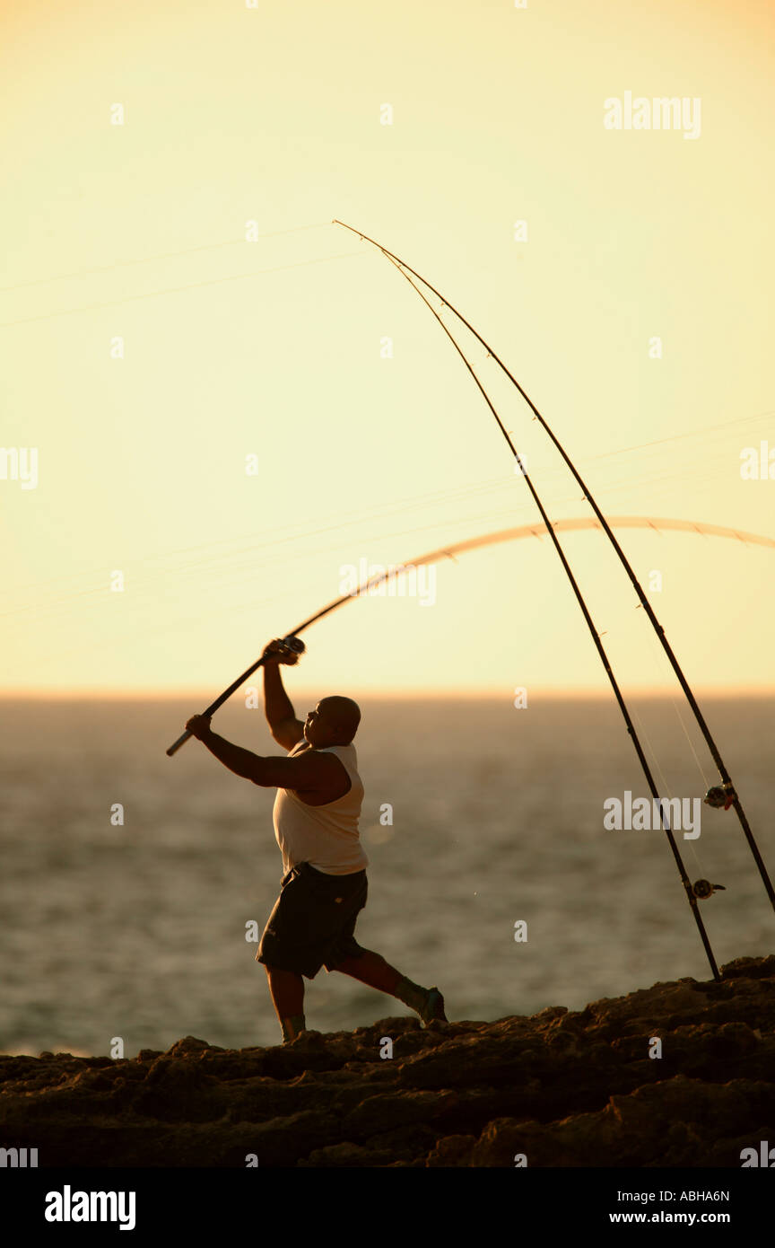 Fishing at Kaena Point sunset coventional surf cast fishing shoreline