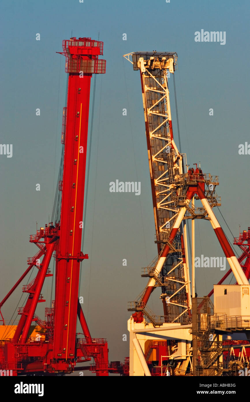 Shipping Industry / Shipping Gantry Cranes at Sunset. Stock Photo