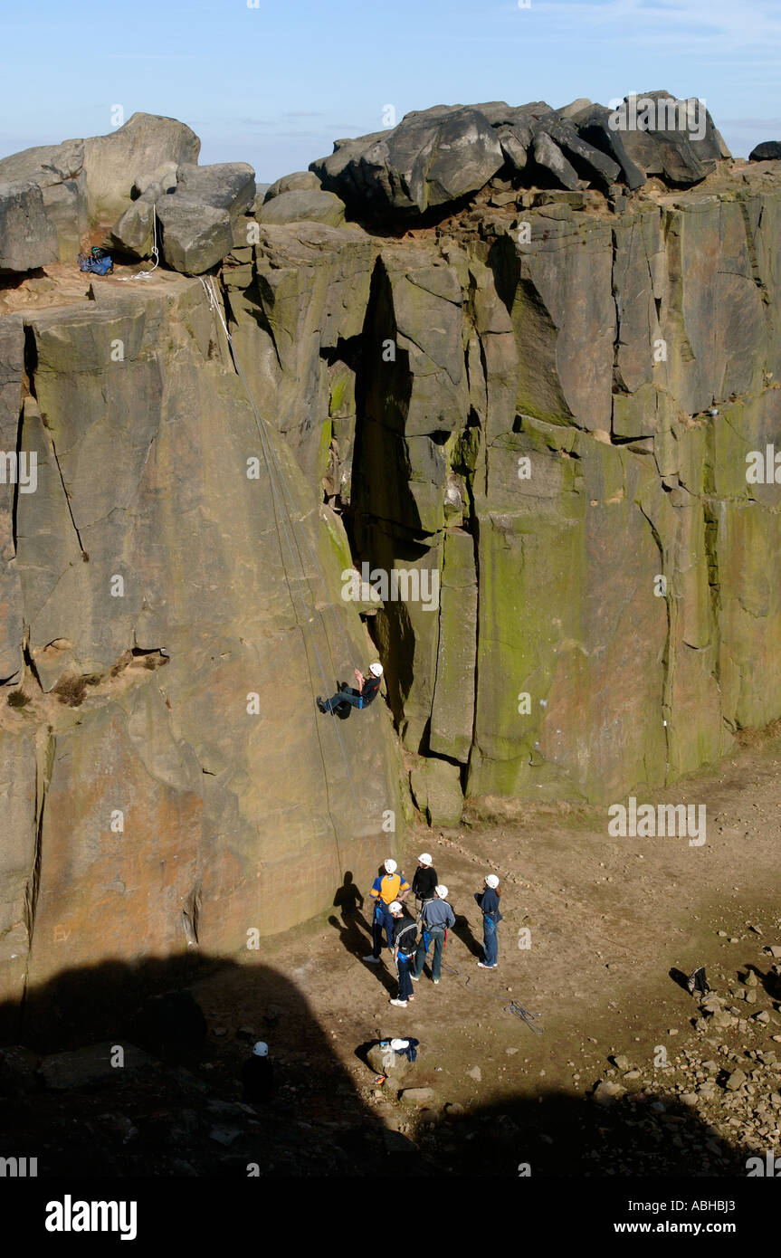 Rock climbing at the Cow and Calf Rocks, Ilkley, Yorkshire UK Stock