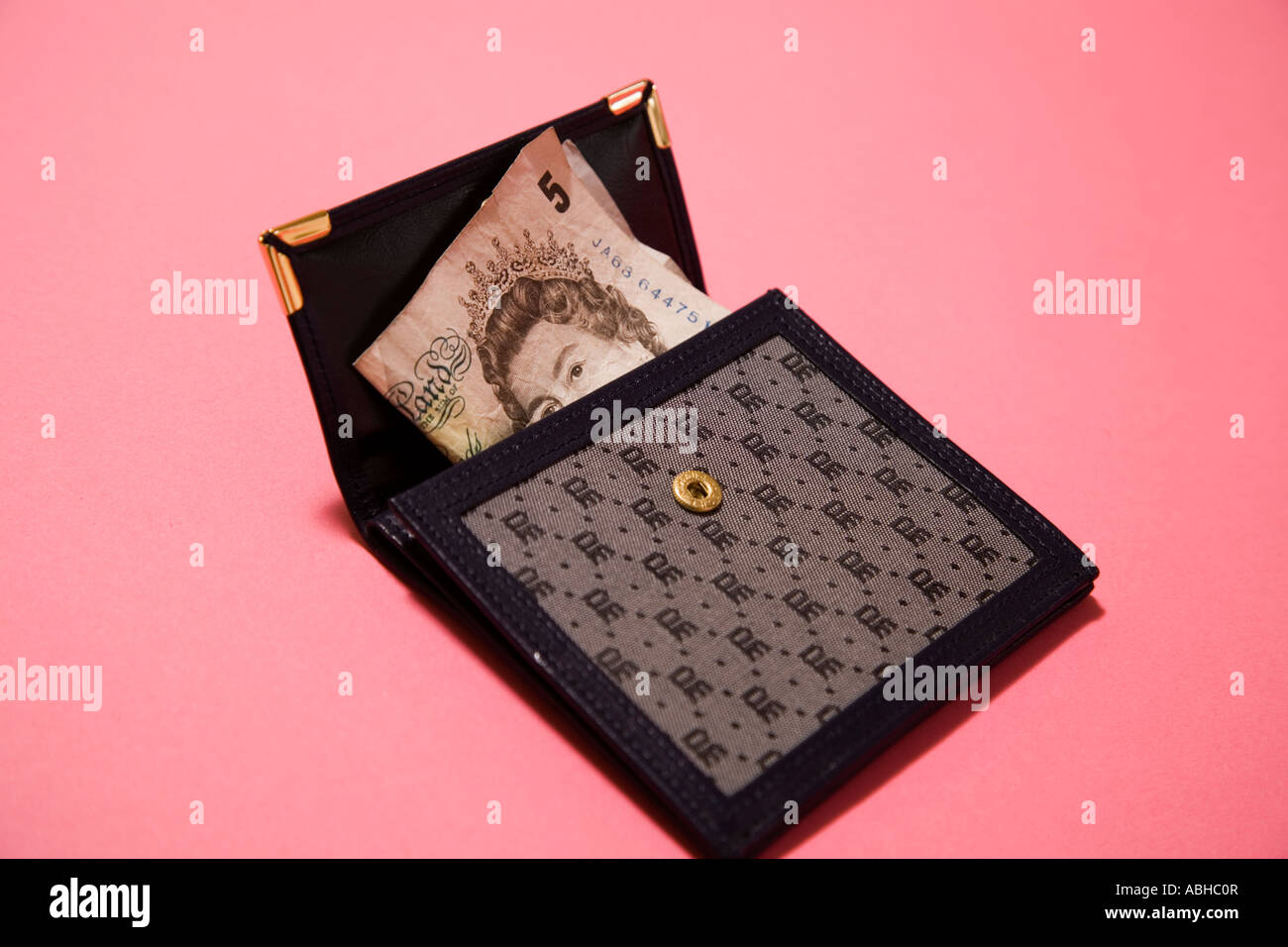womens wallet purse containing five pound note Stock Photo