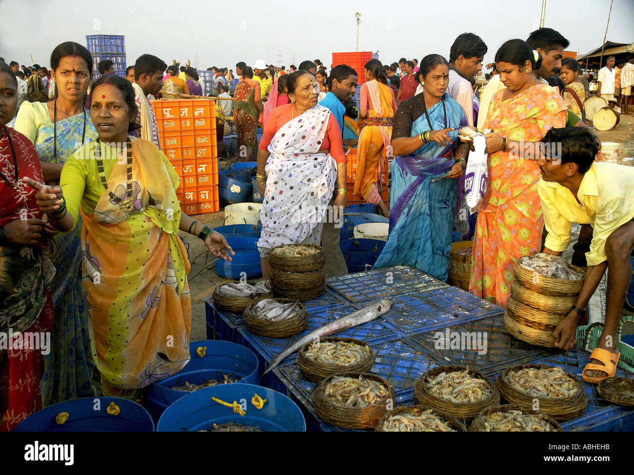 SUB78849 Indian buyers and customers bargaining with fisherwoman Versova fish market Bombay now Mumbai India Stock Photo
