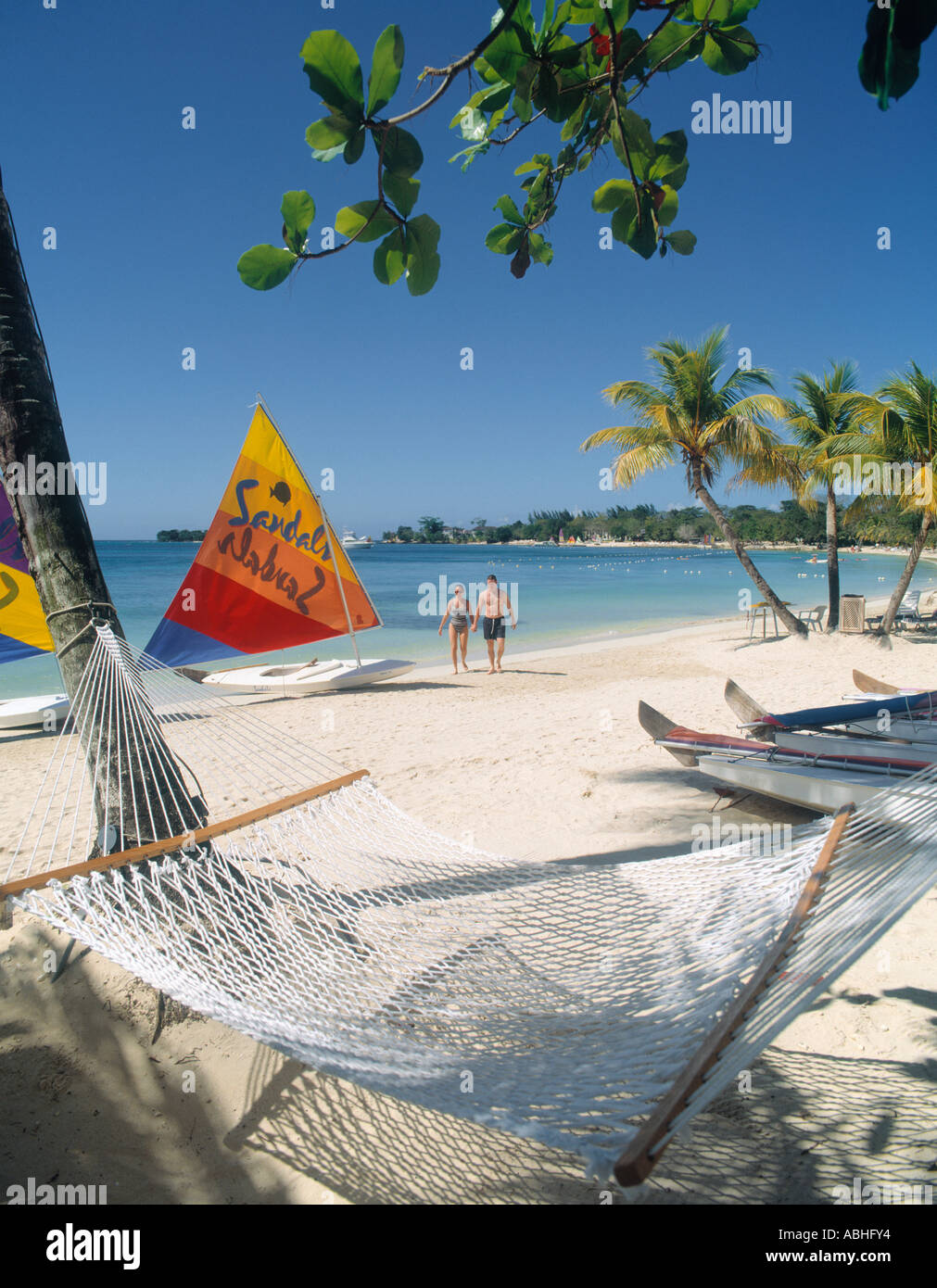 Negril, Jamaica. White sand beach at Sandals Negril Beach Resort and Spa on  Seven Mile Beach Stock Photo - Alamy