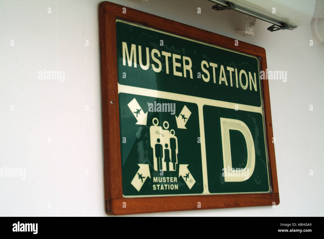 Safety signs on passenger decks of cruise ship showing muster station