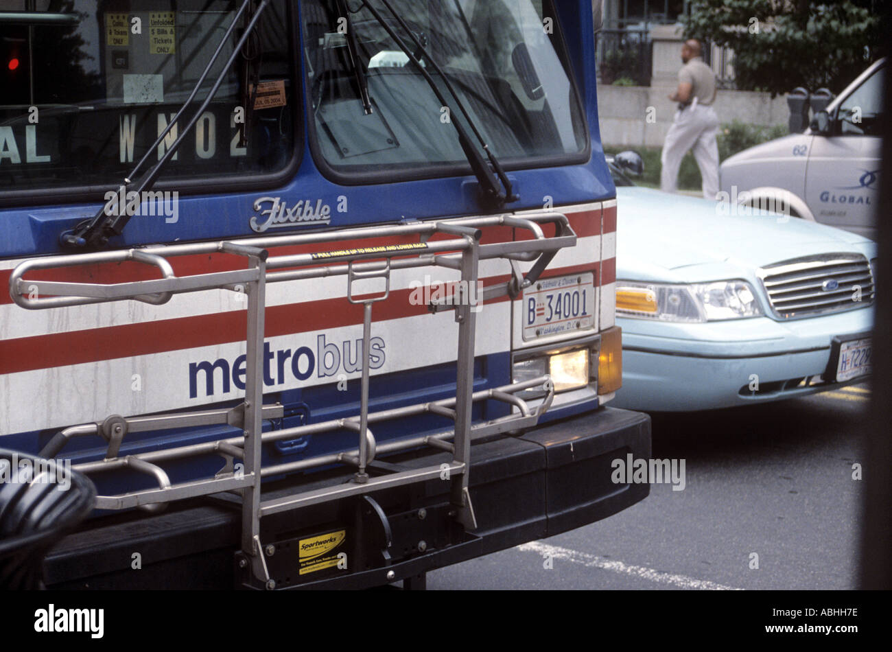 Fixible Metro Bus with car and van in Farragut West area of northwest Washington District of Columbia DC USA Stock Photo