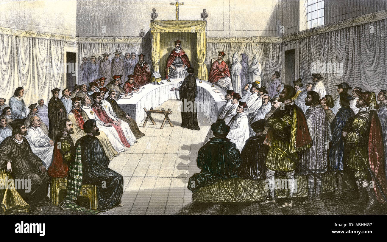 Trial for heresy during the Spanish Inquisition. Hand-colored engraving Stock Photo