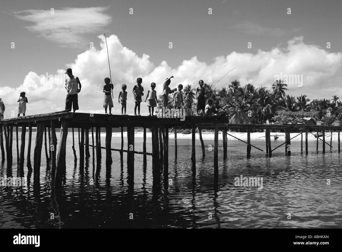 Papuan people welcoming from a small island in Raja Ampat Stock Photo