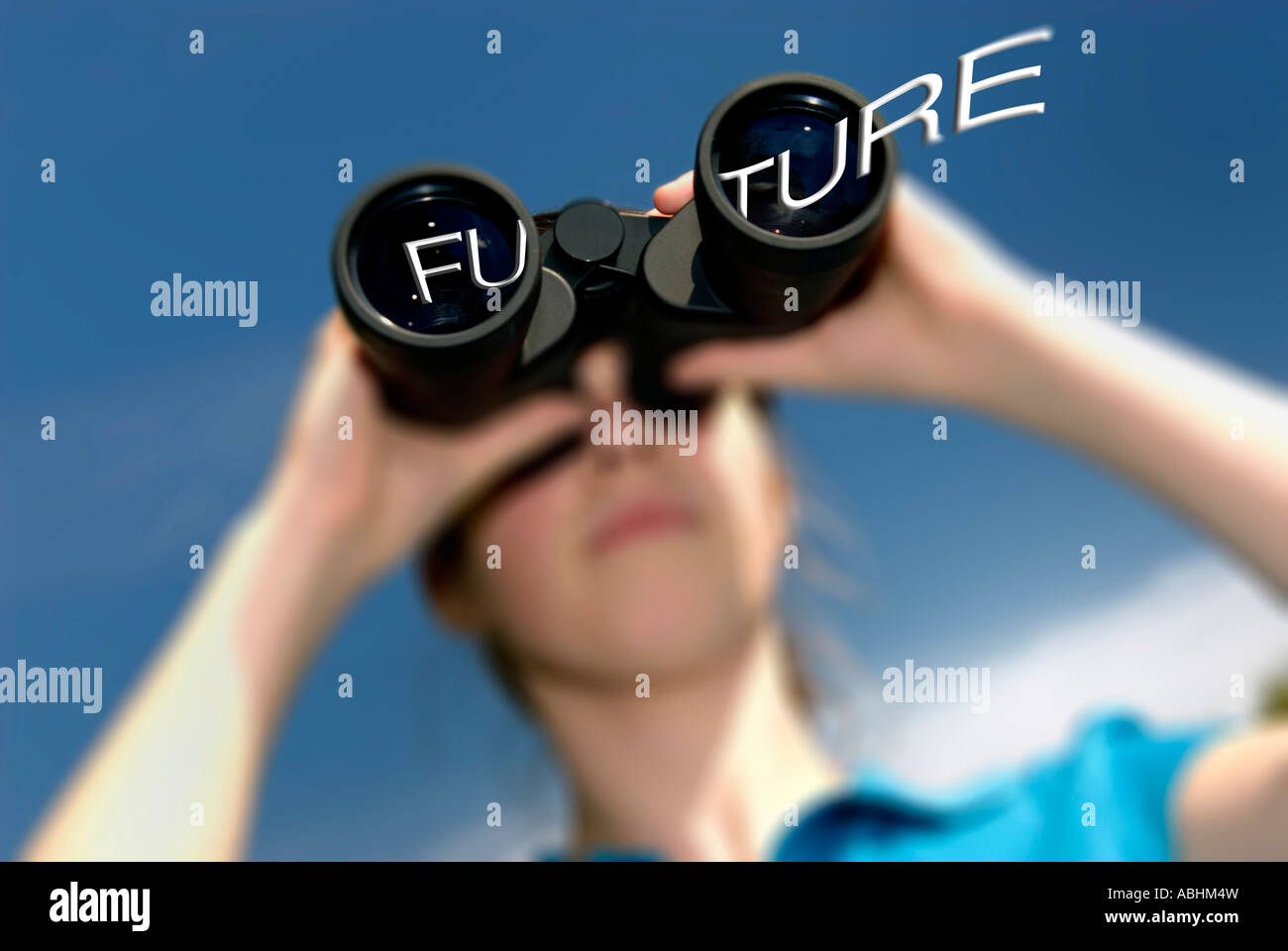 Girl looking through binoculars at her future. Stock Photo