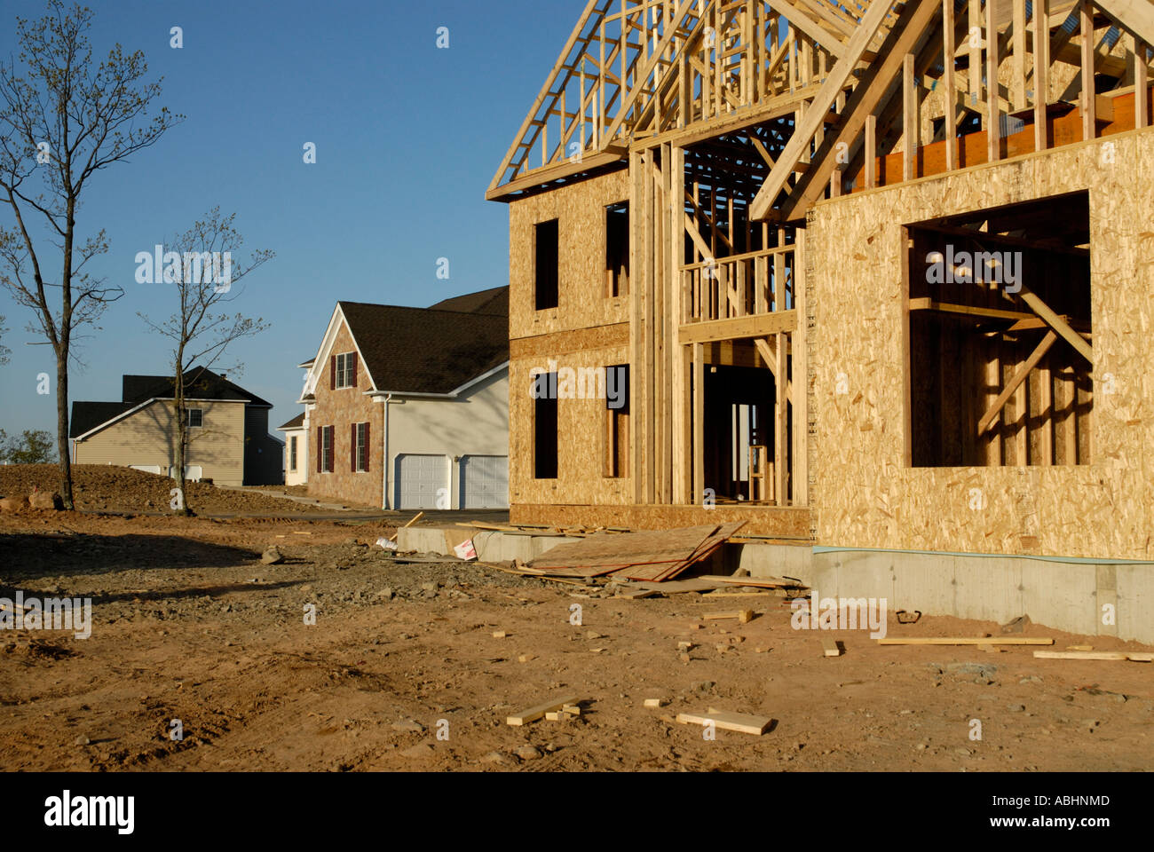 New suburban housing development under construction with finished and newly framed houses Stock Photo