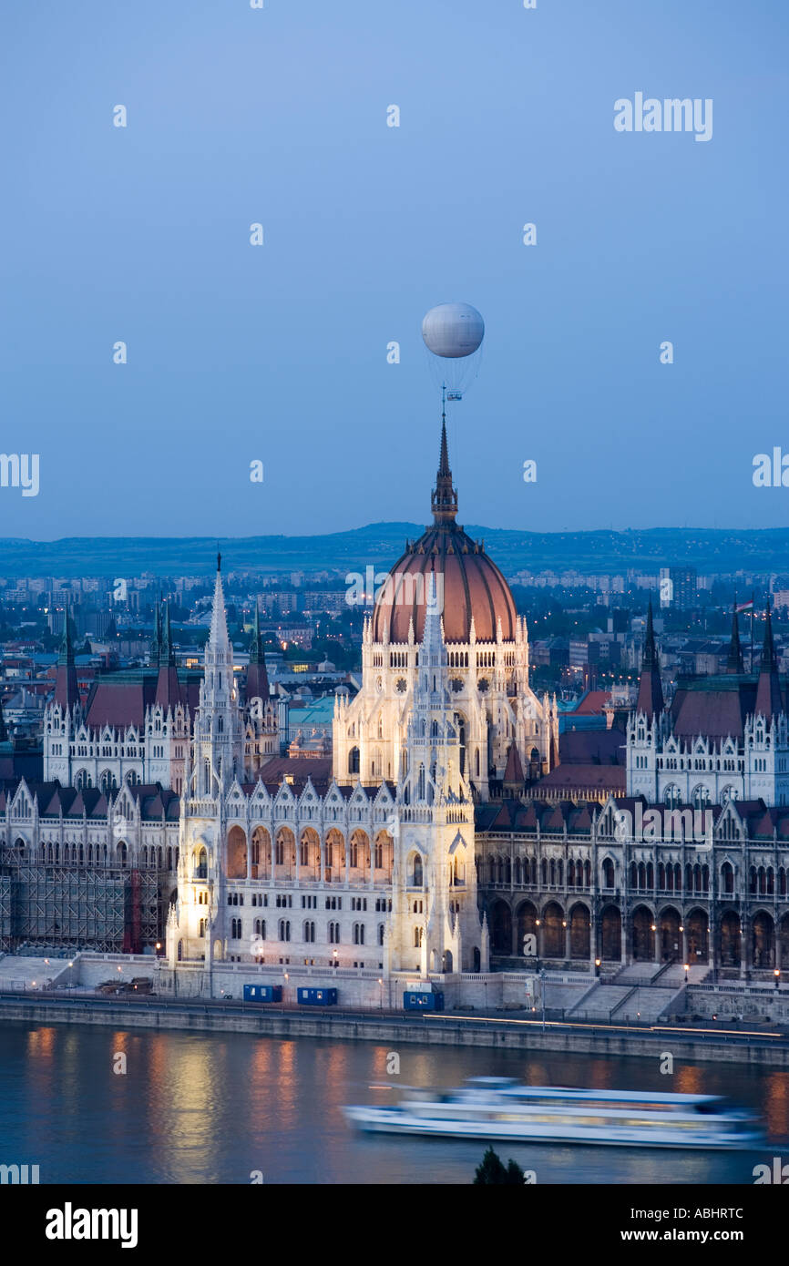 View over the Danube river to the illuminated Parliament in the evening Pest Budapest Hungary Stock Photo