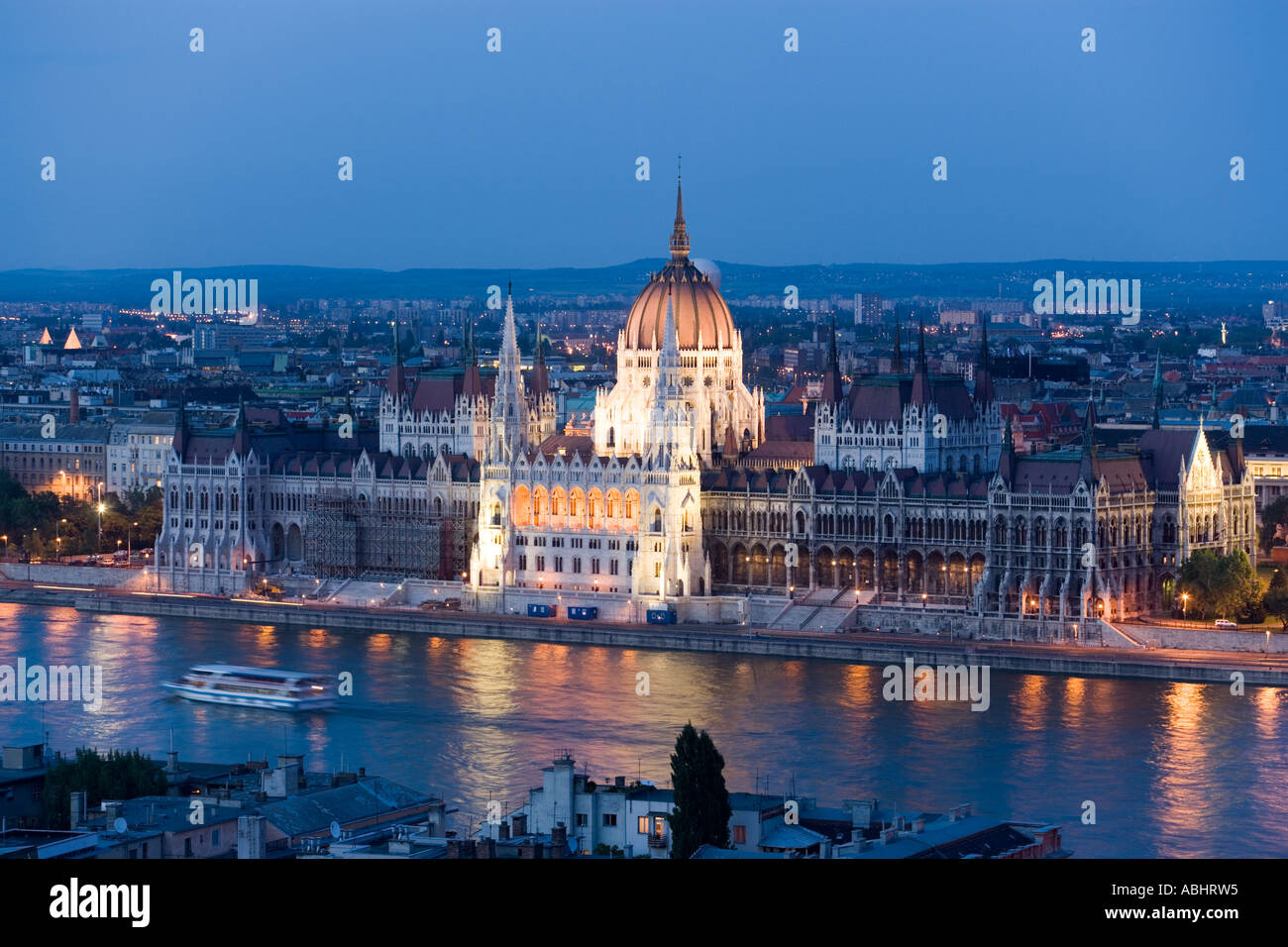 View over the Danube river to the illuminated Parliament in the evening Pest Budapest Hungary Stock Photo
