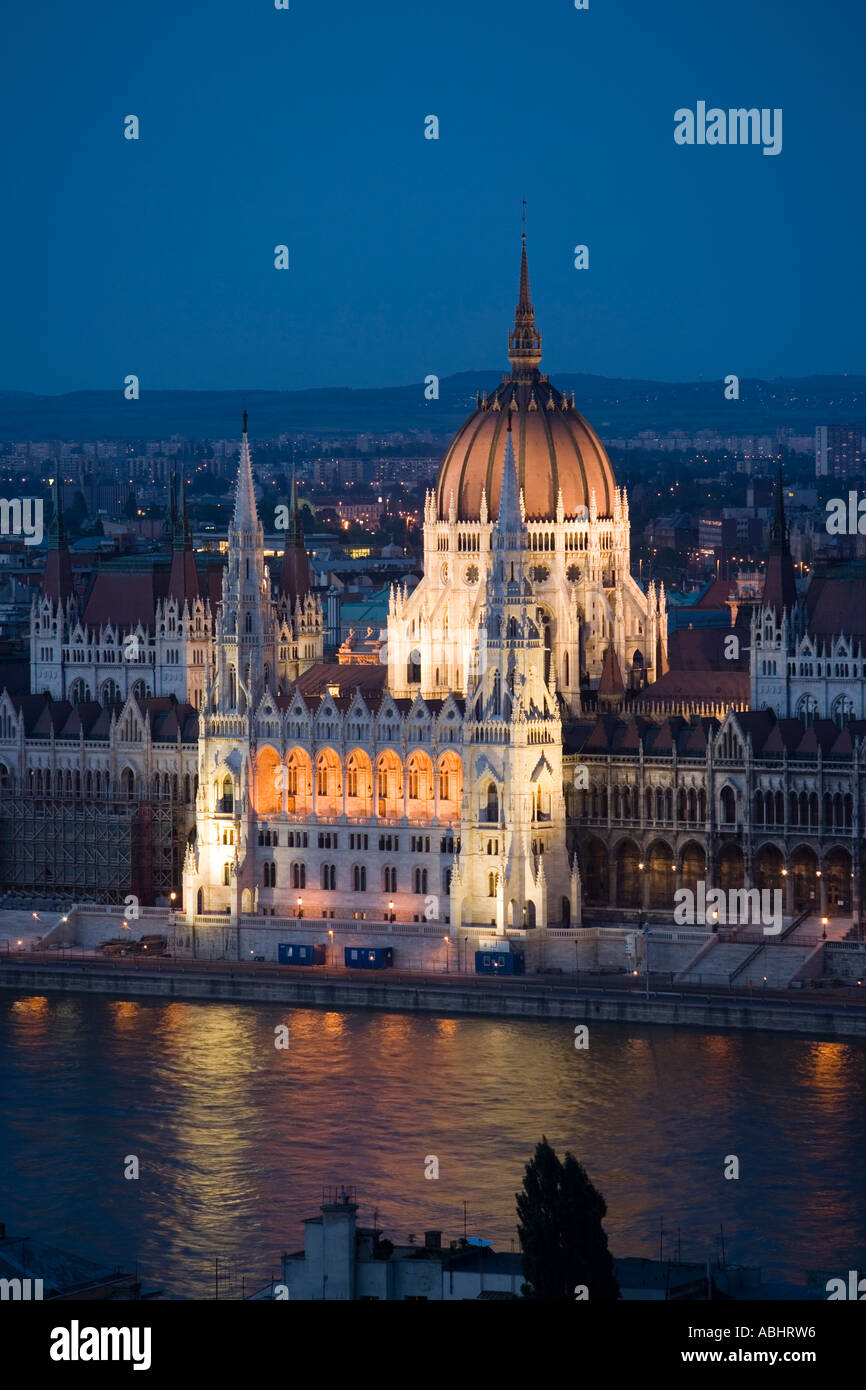 View over the Danube river to the illuminated Parliament at night Pest Budapest Hungary Stock Photo