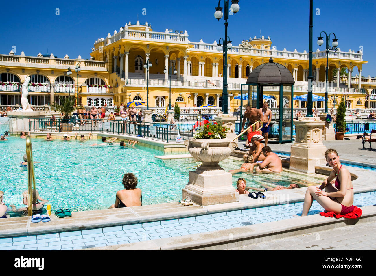People relaxing at open air areo of the Szechenyi baths Pest Budapest