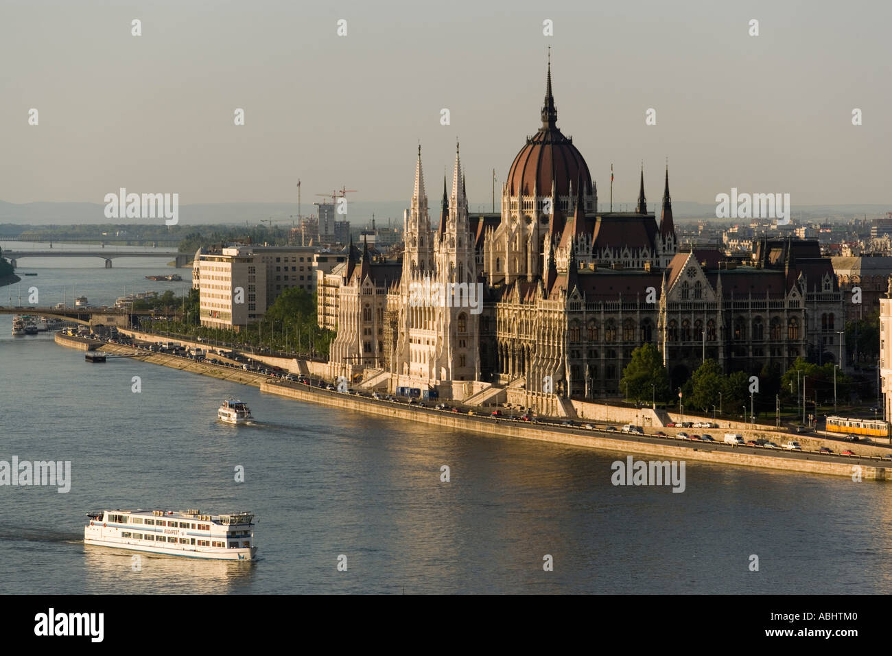 View over the Danube river with boats to the Parliament Pest Budapest Hungary Stock Photo