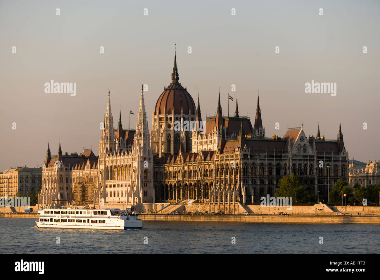 A leisure boat on the Danube river passing the Parliament Pest Budapest Hungary Stock Photo