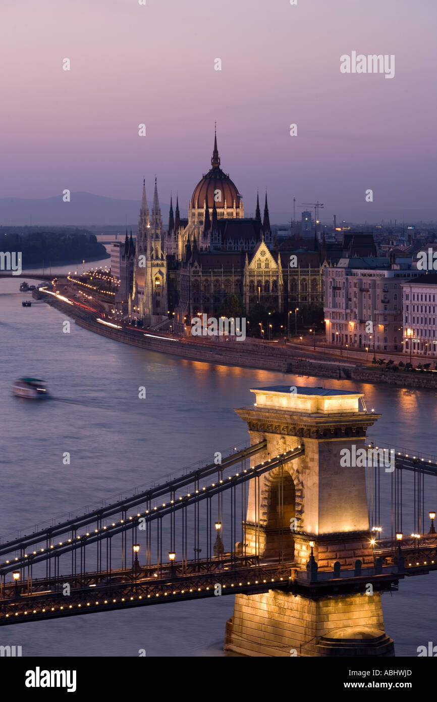 View over the Szechenyi Chain Bridge and the river Danube to the Parliament in the evening Pest Budapest Hungary Stock Photo