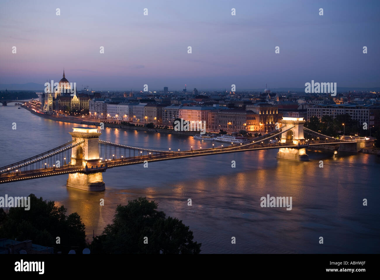View over the river Danube with Szechenyi Chain Bridge to Pest with the Parliament in the evening Pest Budapest Hungary Stock Photo