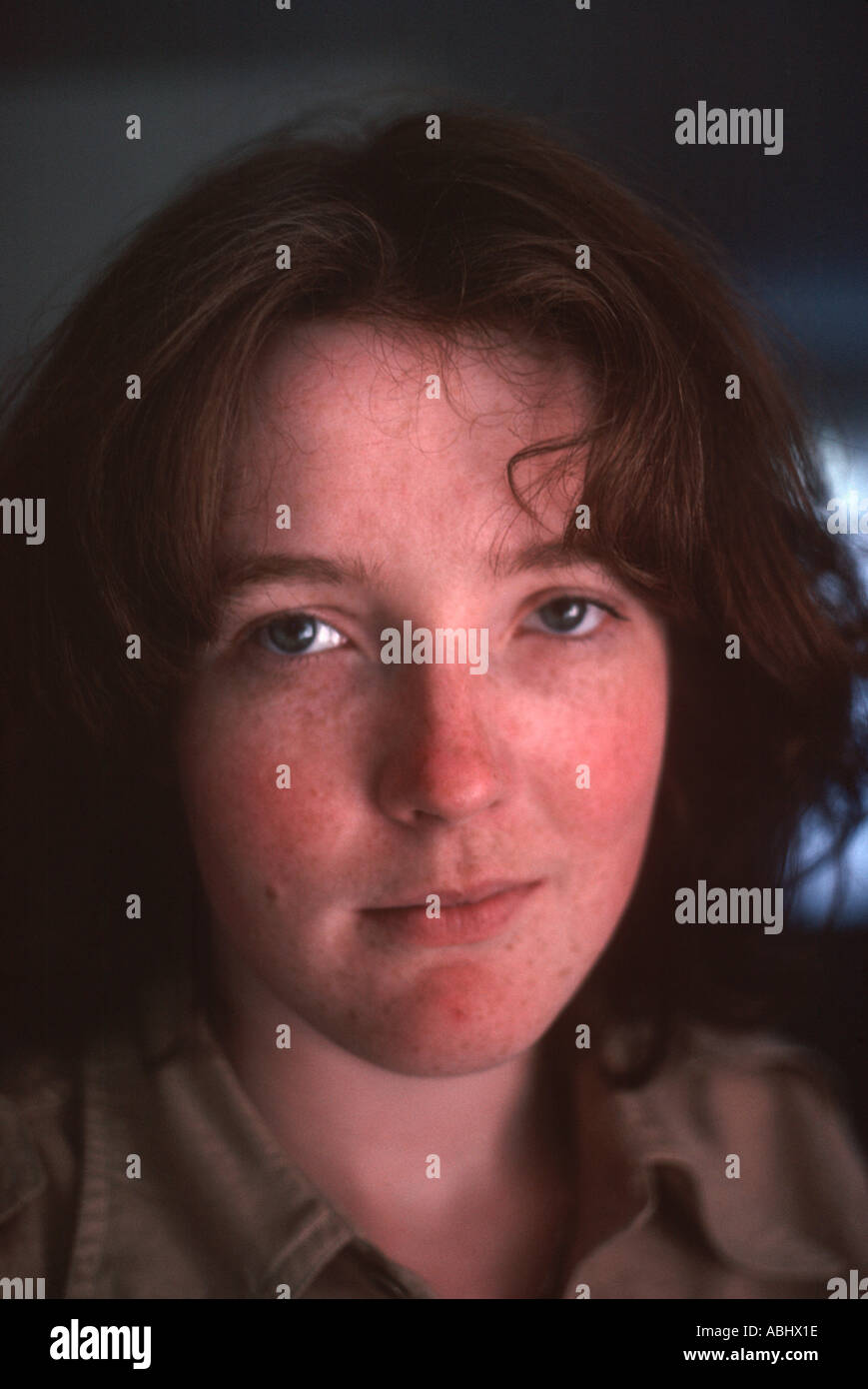 Natural Looking Young Woman With Dark Red Hair And Freckles Stock