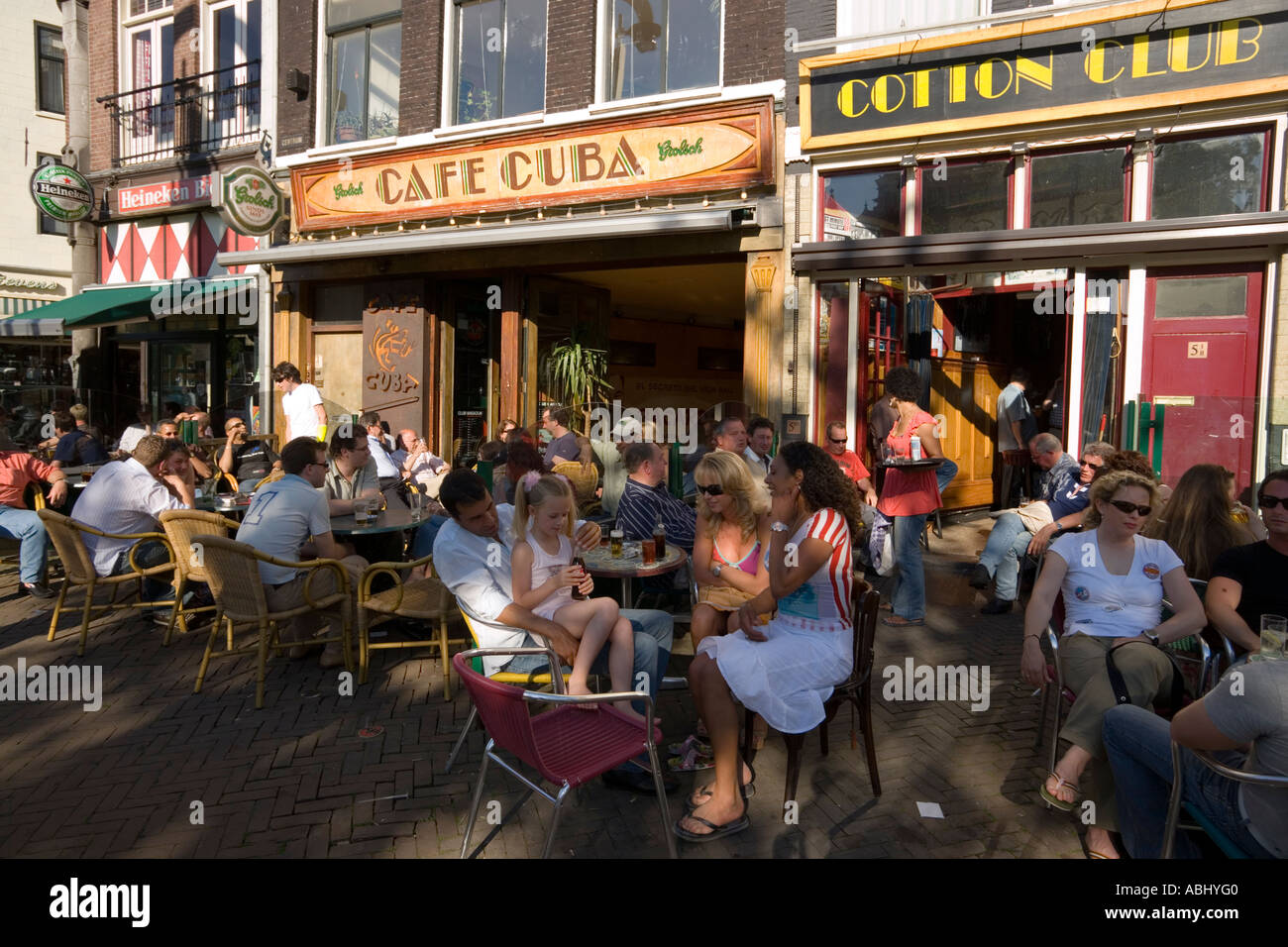 People sitting in open air cafes Nieuwmarkt new market Amsterdam Holland Netherlands Stock Photo