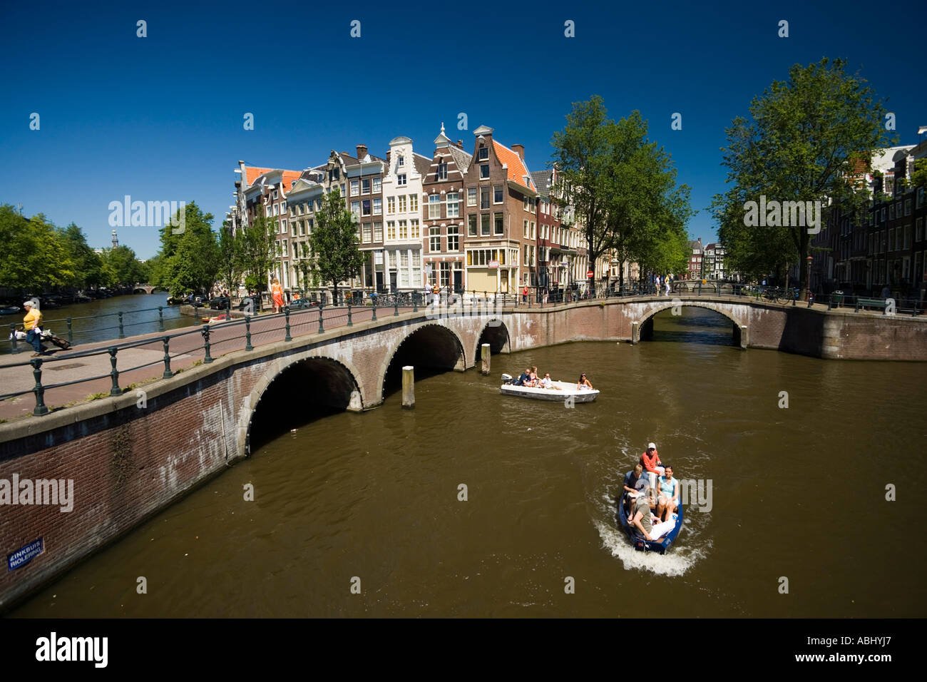 People in a small leisure boat Keizersgracht and Leidsegracht Amsterdam Holland Netherlands Stock Photo