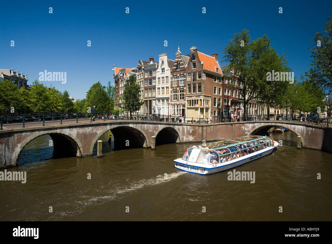 Excursion boat on Keizersgracht and Leidsegracht Amsterdam Holland Netherlands Stock Photo