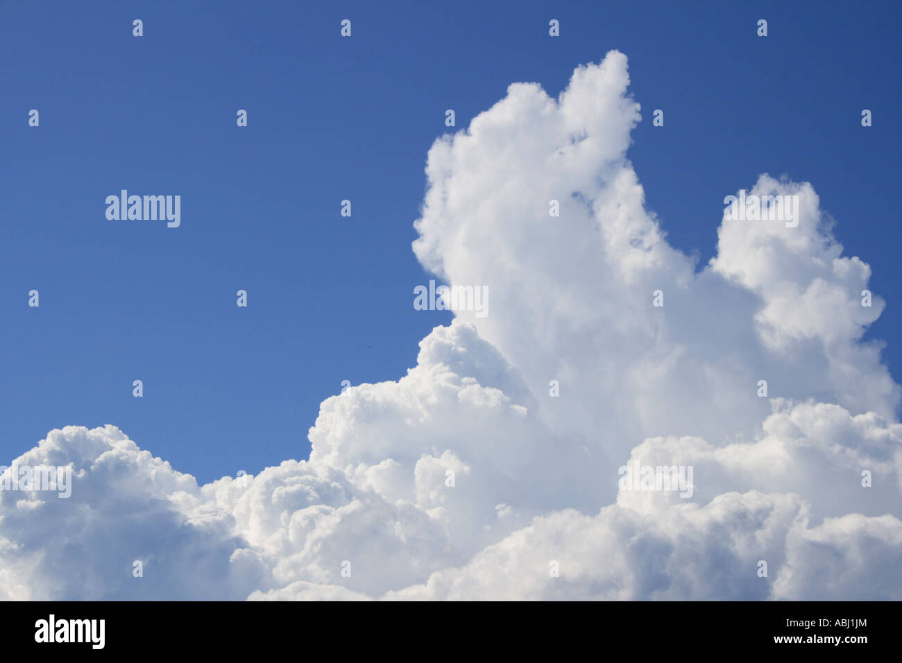 Storm clouds gathering against a blue sky. Photo by Willy Matheisl Stock Photo