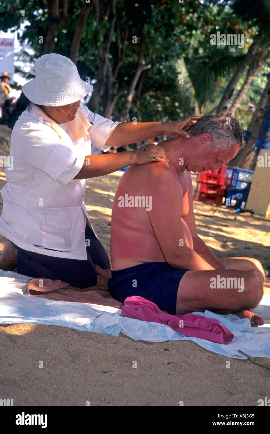 Massage on the beach, Pattaya, Thailand Stock Photo - Alamy