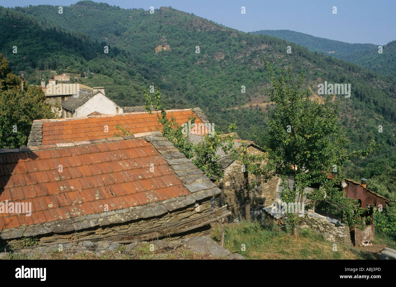 View over hills and roofs, Cevennes mountains, Lozere, Lauguedoc-Rousillon, France Stock Photo