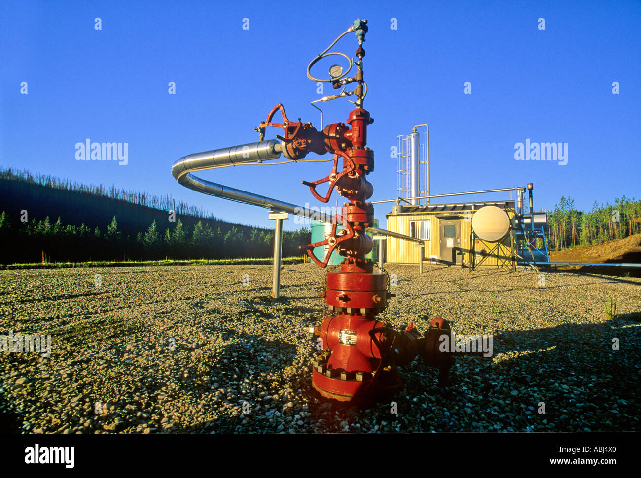 Natural Gas Well Head and storage tanks Stock Photo