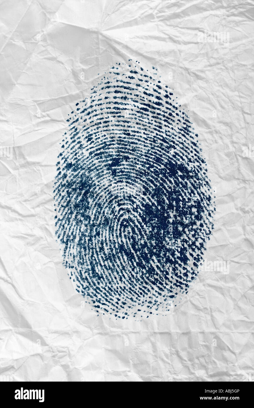 Crumpled piece of paper with blue fingerprint Stock Photo
