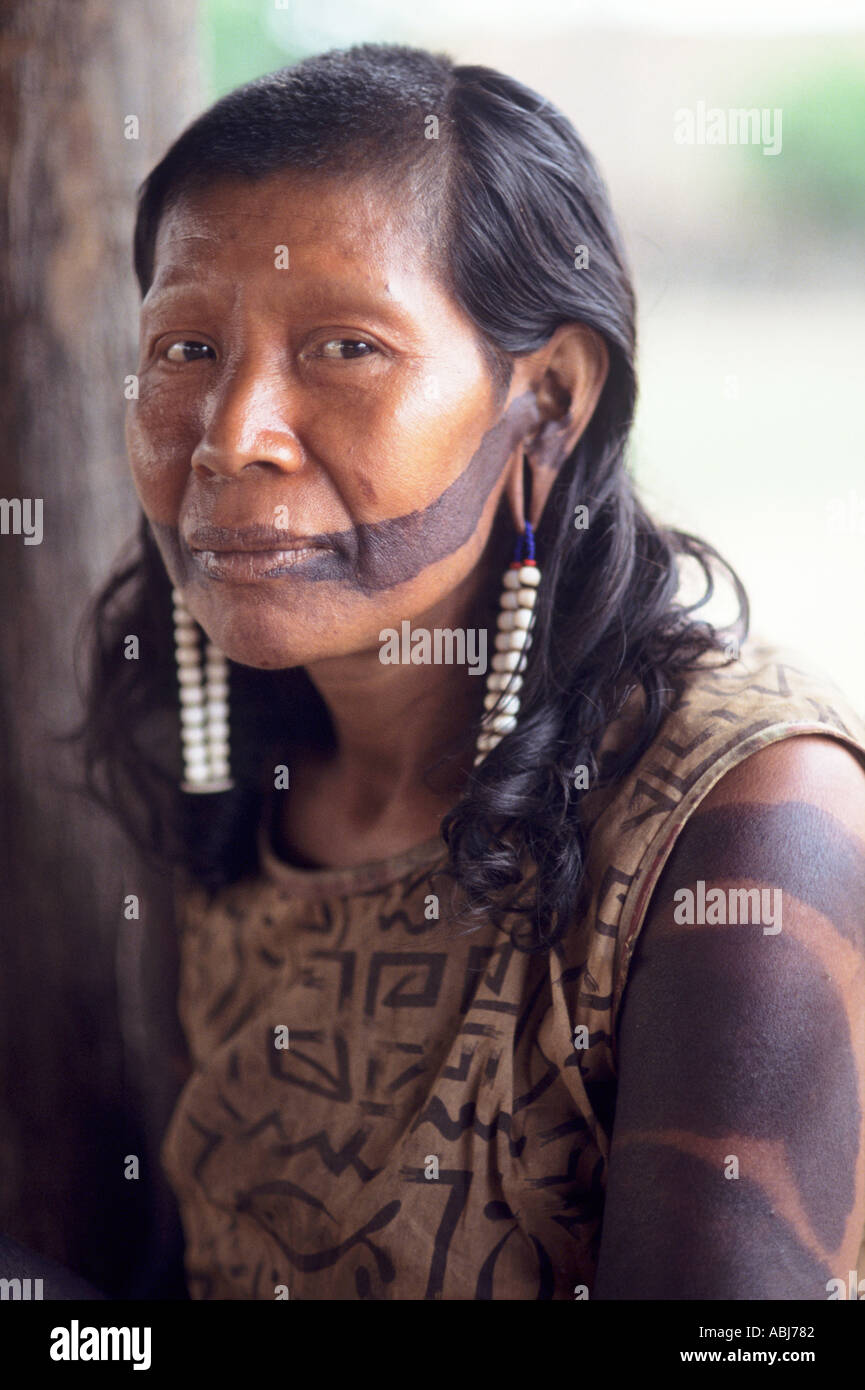Pikany Village, Brazil. Kayapo Indian woman with black body paint and wearing earrings. Stock Photo