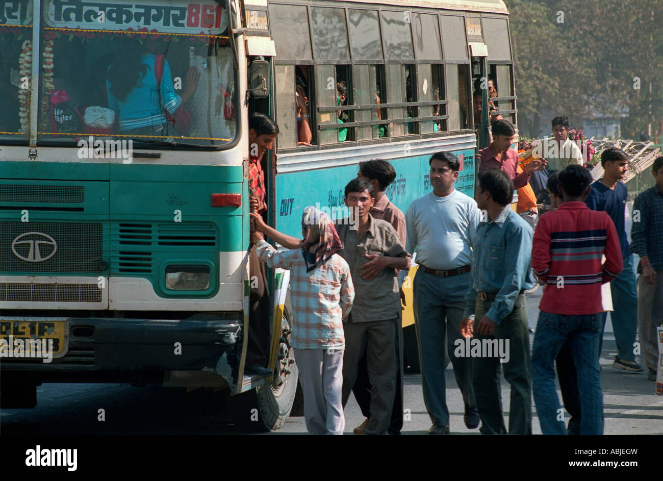 Passengers boarding a bus in India Stock Photo