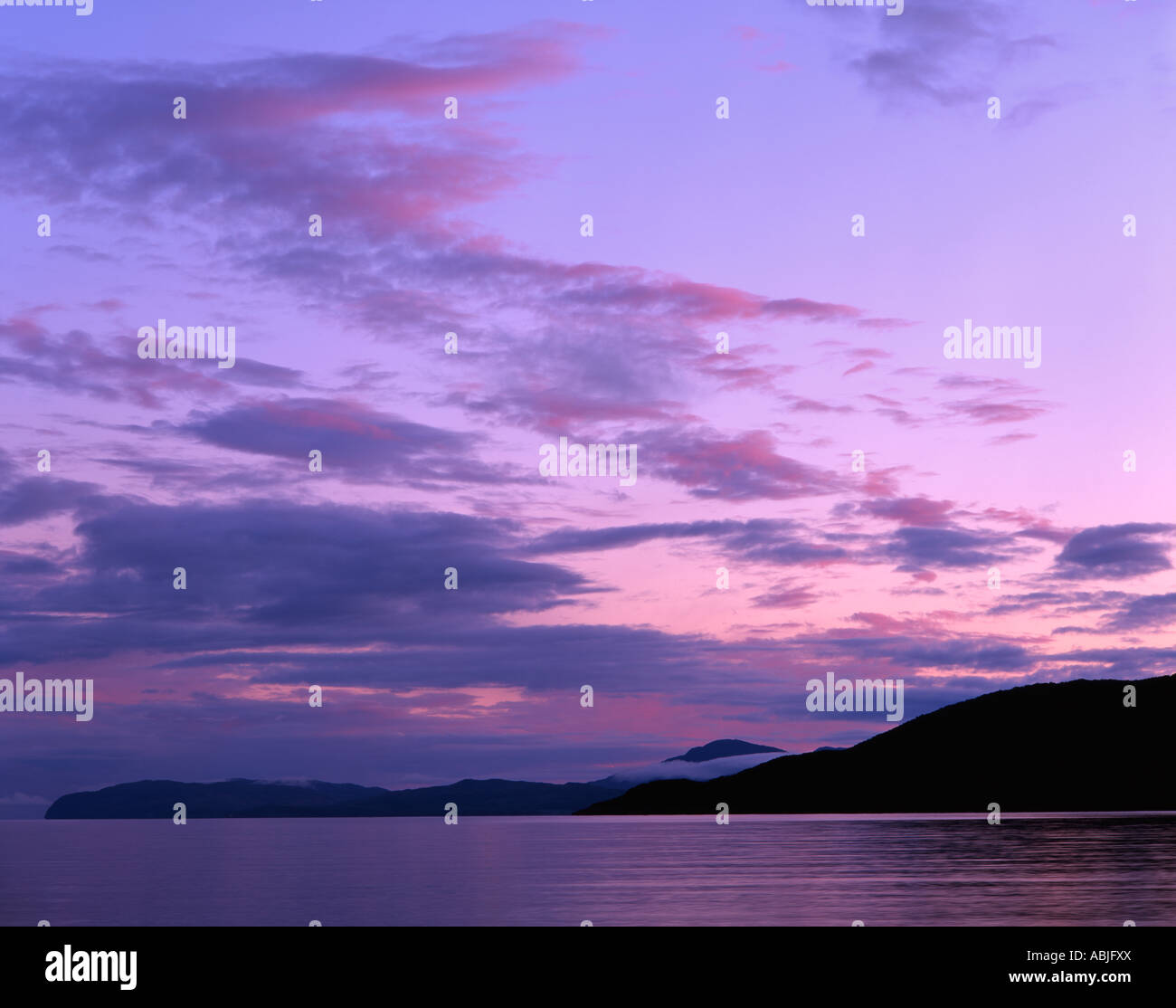 Pink clouds over Mull viewed from Tralee Bay, Benderloch, Oban, Argyll Stock Photo