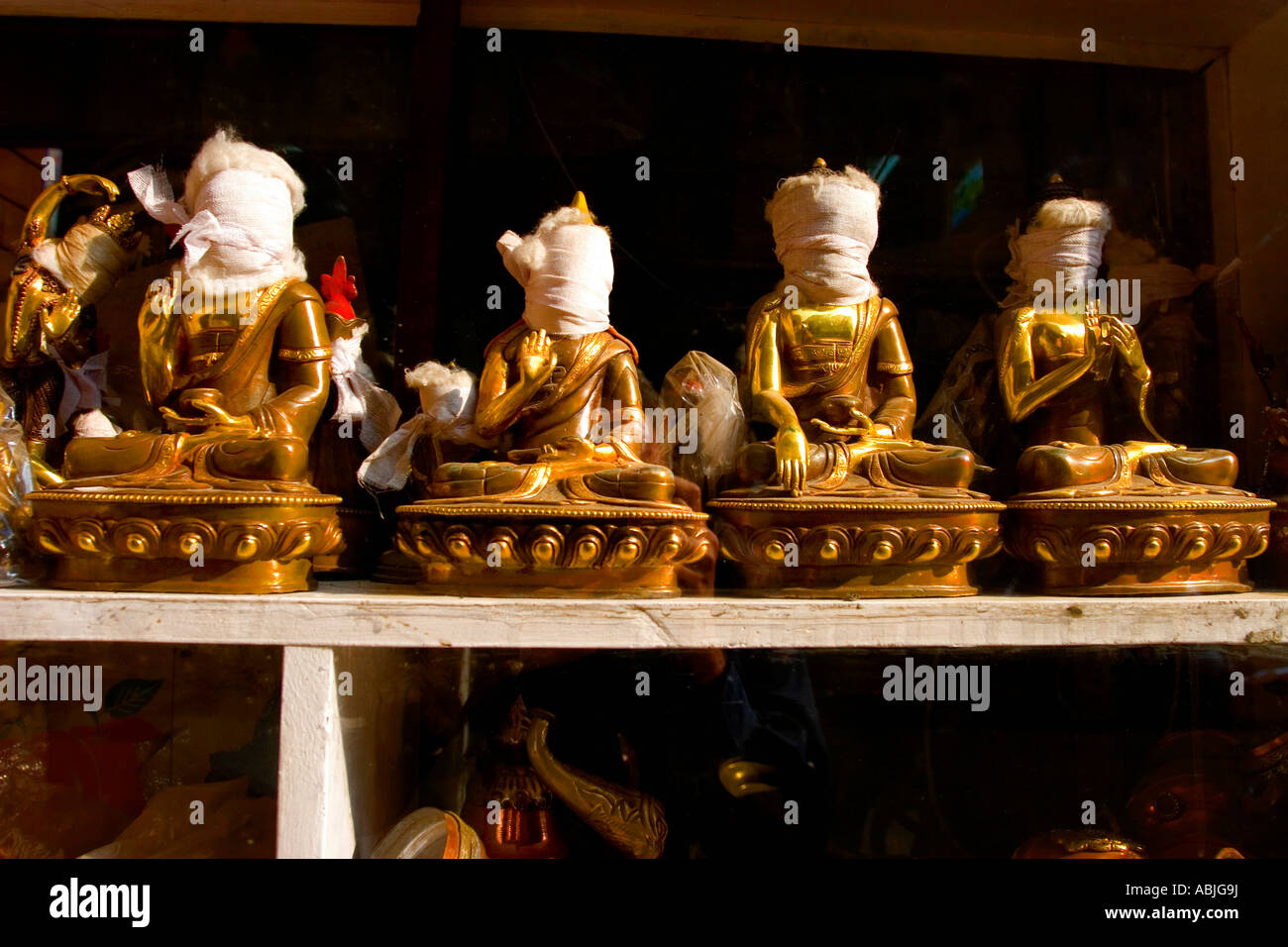 A shop selling Buddha statues in Durbar Square. The Buddha's faces are wrapped to protect their