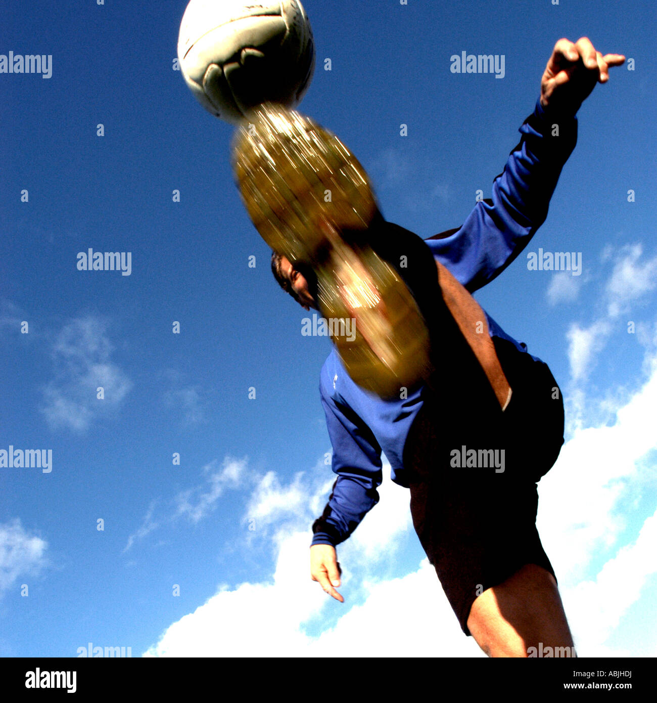 Football player kicking a football. Picture by Patrick Steel patricksteel Stock Photo