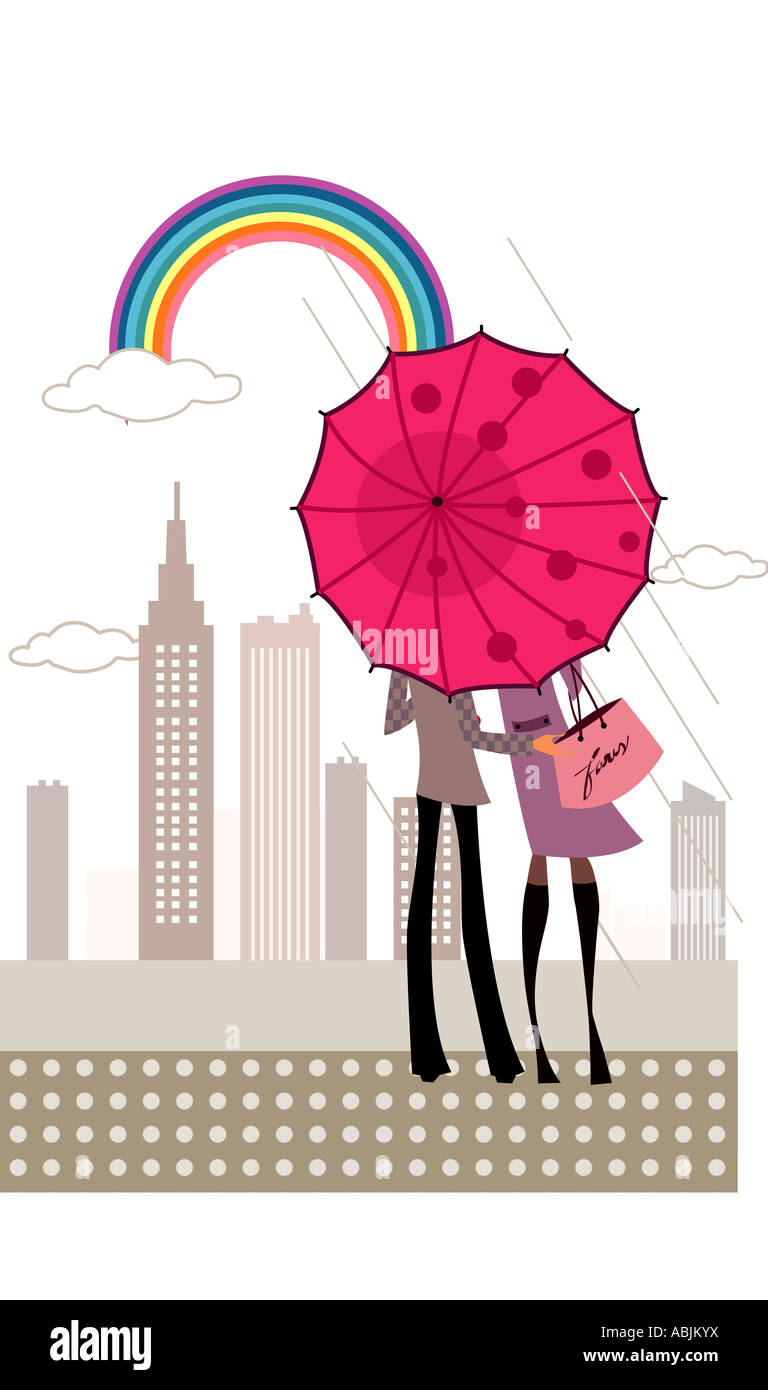 Rear view of a couple standing under an umbrella Stock Photo - Alamy