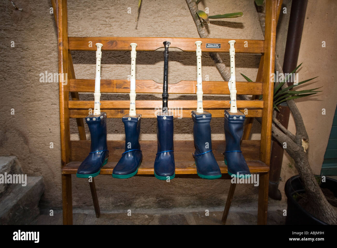 Handmade misical instrument made out of rubber boots and flutes Stock Photo