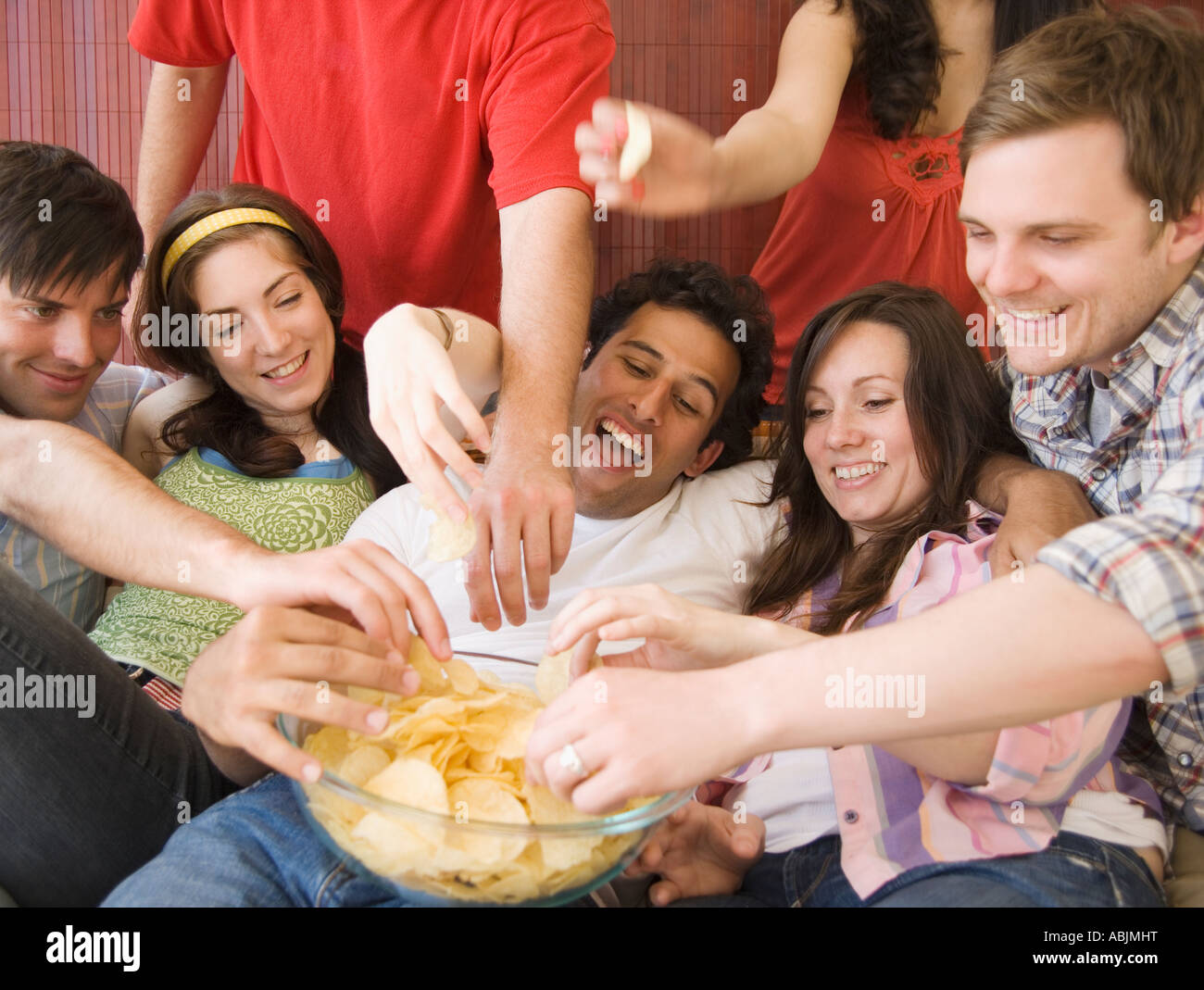 Friends eating chips Stock Photo 12908435 Alamy
