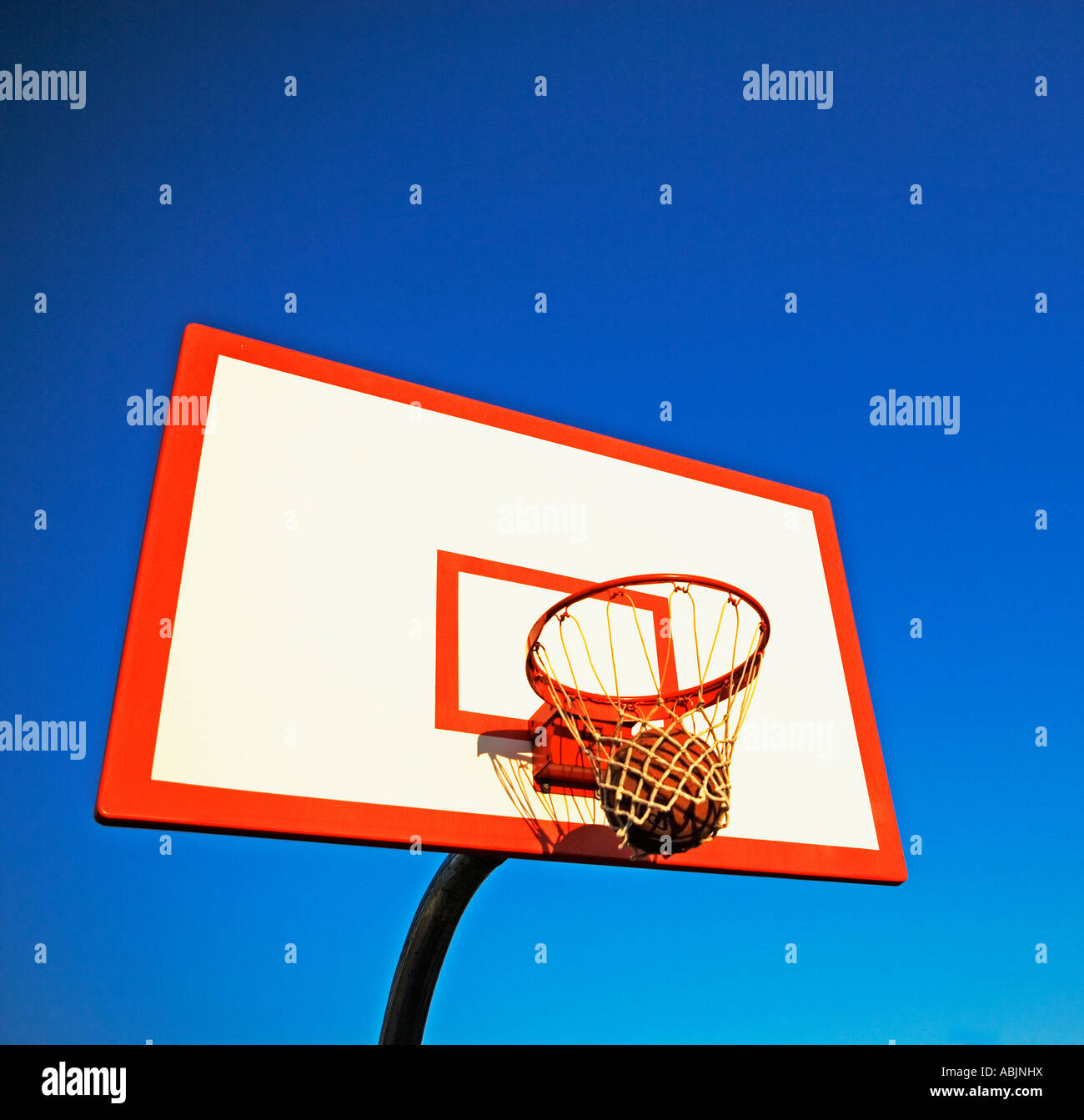Basketball in hoop Stock Photo Alamy